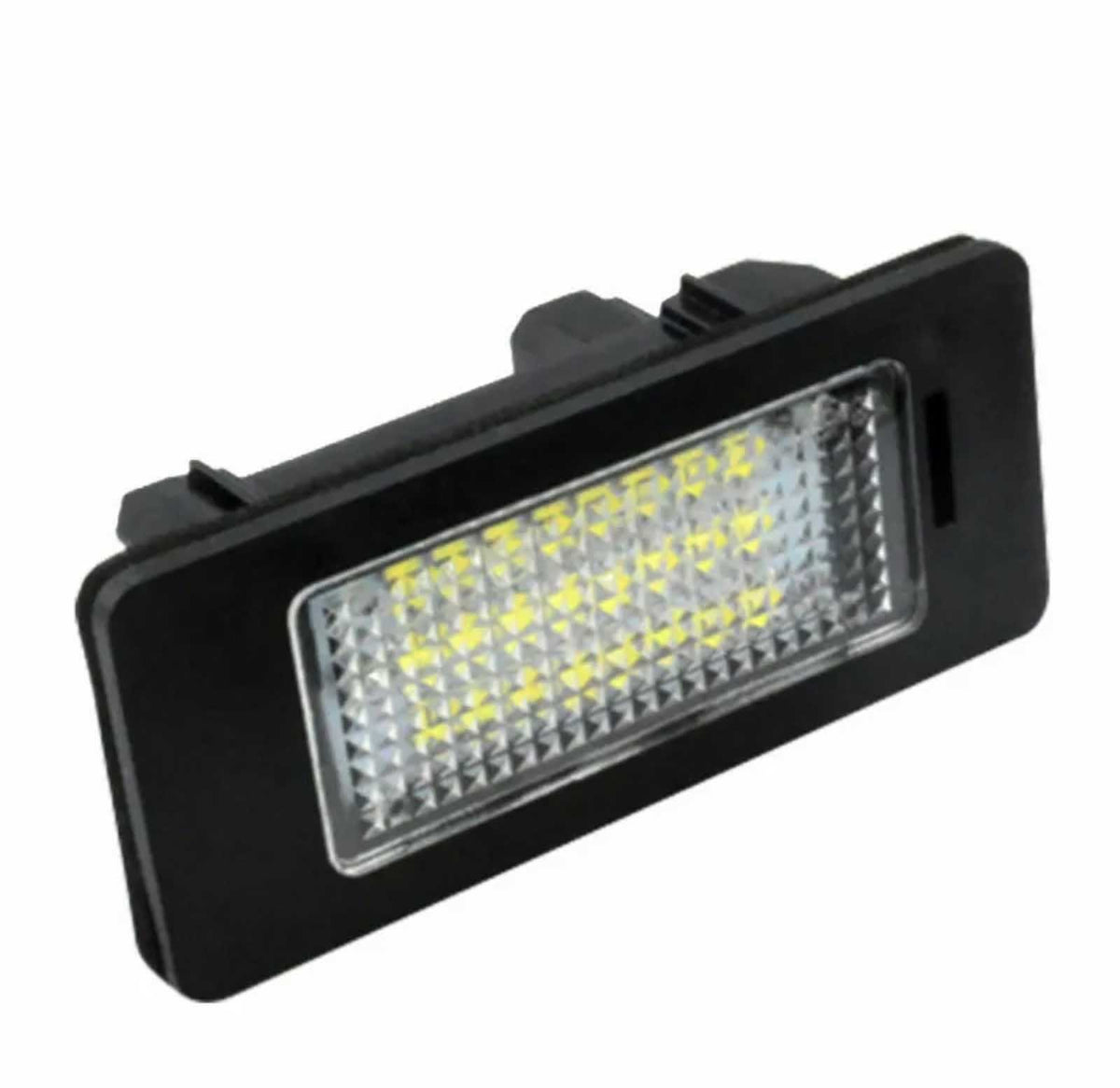 A rectangular LED car light unit is angled slightly upward, featuring a series of yellow LEDs within a textured, transparent panel. The outer casing is black, set against a white background.