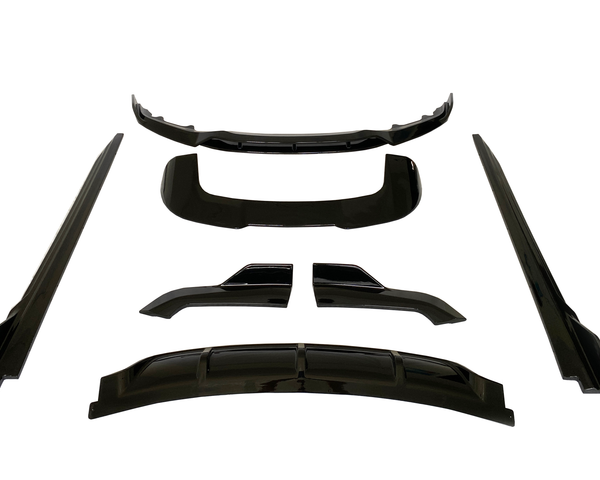 Black car body kit pieces arranged on a white background, including a bumper lip, side skirts, and diffuser parts, all presented symmetrically and evenly spaced.