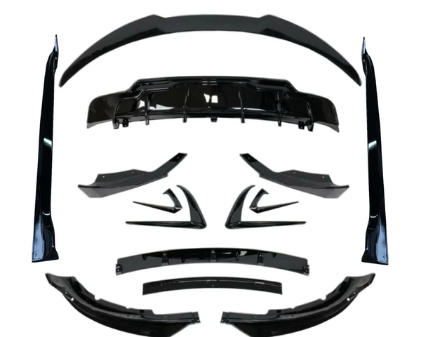 Various black car body kit components, including spoilers and diffusers, arranged symmetrically on a white background, showcasing their design and shape for automotive customization.