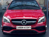A red Mercedes-Benz car is parked inside a building, facing forward. The license plate reads 
