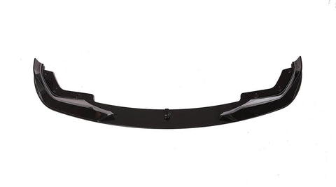 A sleek, black car front lip spoiler, resting on a white background, showcasing its aerodynamic shape with curved ends and bolt fixtures.