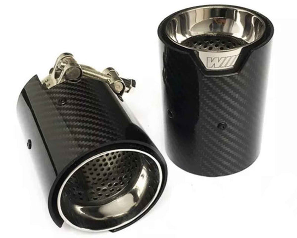 Two carbon fiber exhaust tips with a metallic interior, one upright, the other lying down showing adjustable clamps. Both feature a "W" insignia. Set against a plain white background.