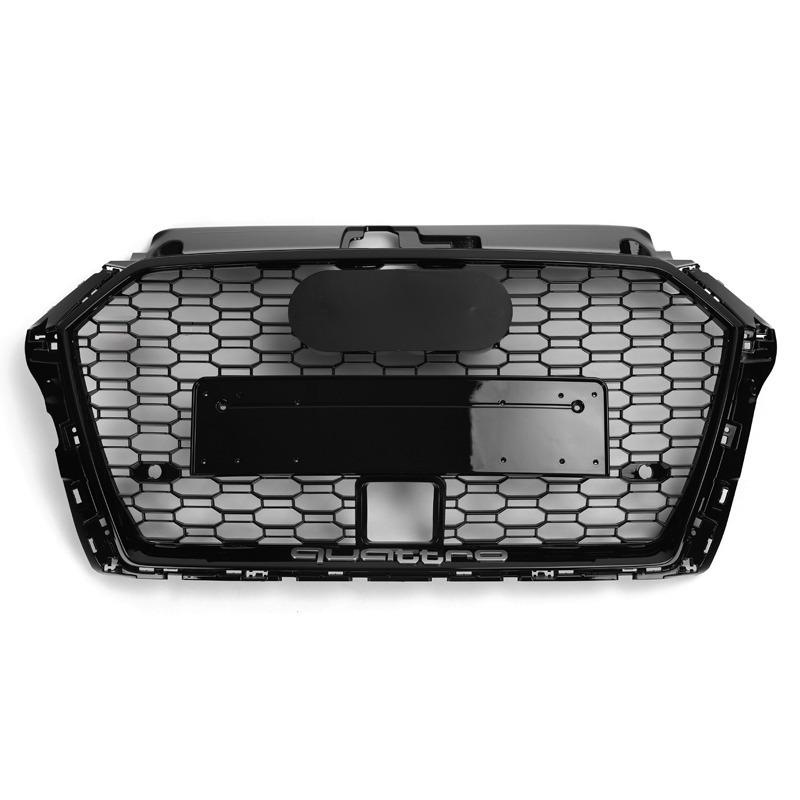 A black hexagonal car grille with a central mounting area sits against a white background. The word "quattro" is embossed at the bottom.