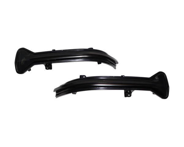 Two black, curved plastic car parts with attachment points rest against a white background, likely designed for vehicle installation or modification.