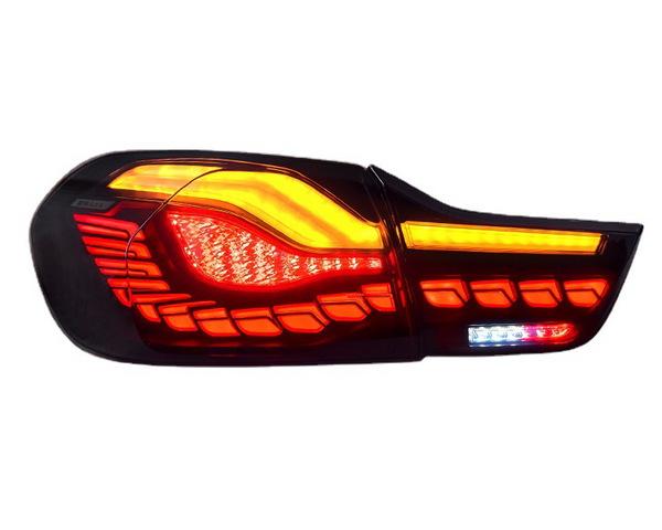 A car taillight emits bright red and amber light patterns. The angular, modern design is set against a plain, white background.