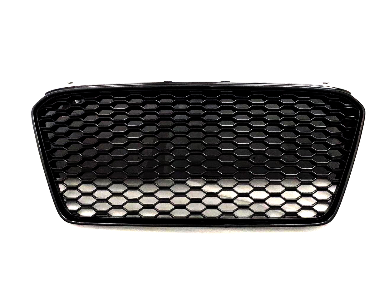 A black car grille with a honeycomb pattern appears against a plain white background, showcasing its sleek design and geometric texture.