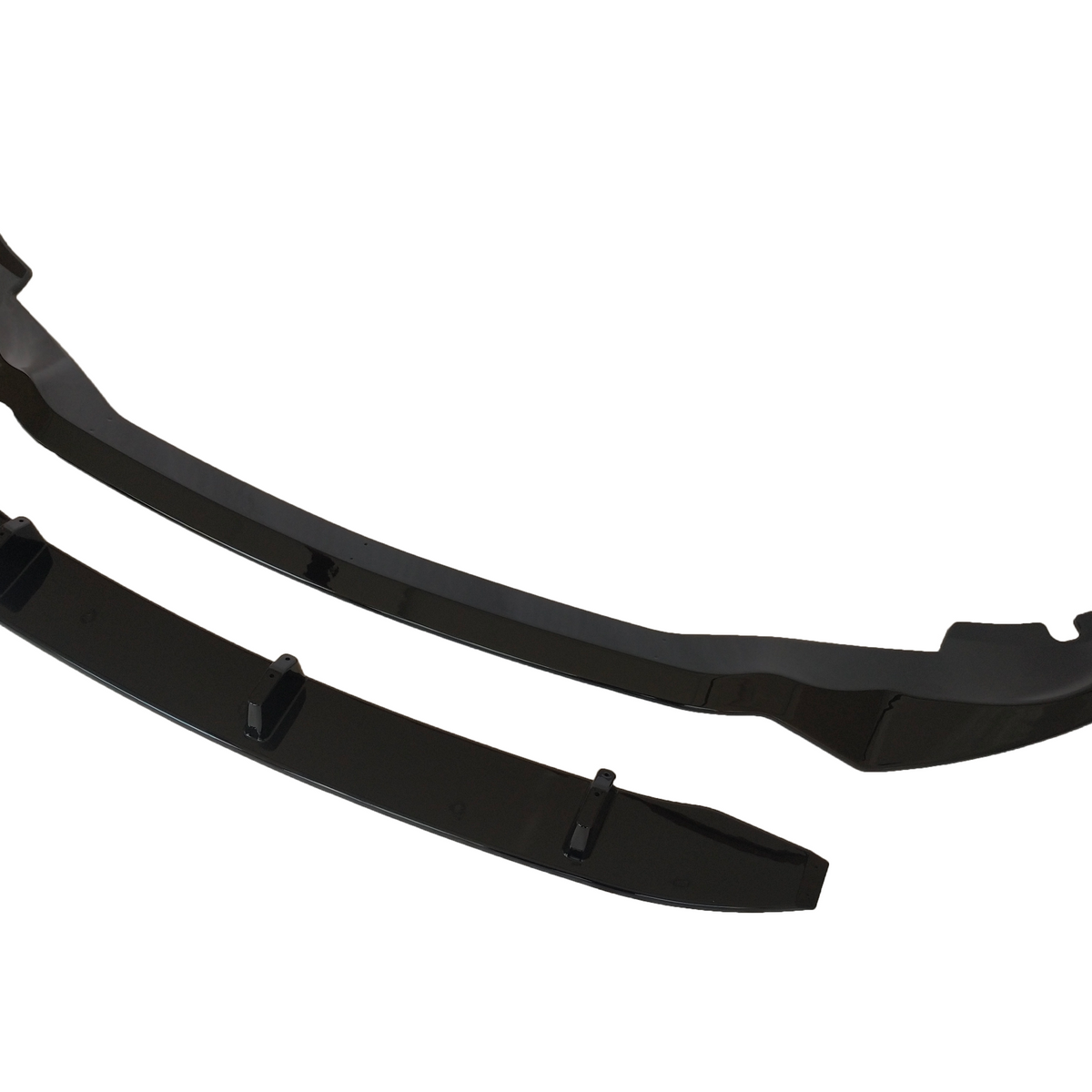 Two glossy black car bumper lip spoilers, positioned side by side, are displayed on a white background. The larger piece features curved ends, while the smaller piece is rectangular with fins.