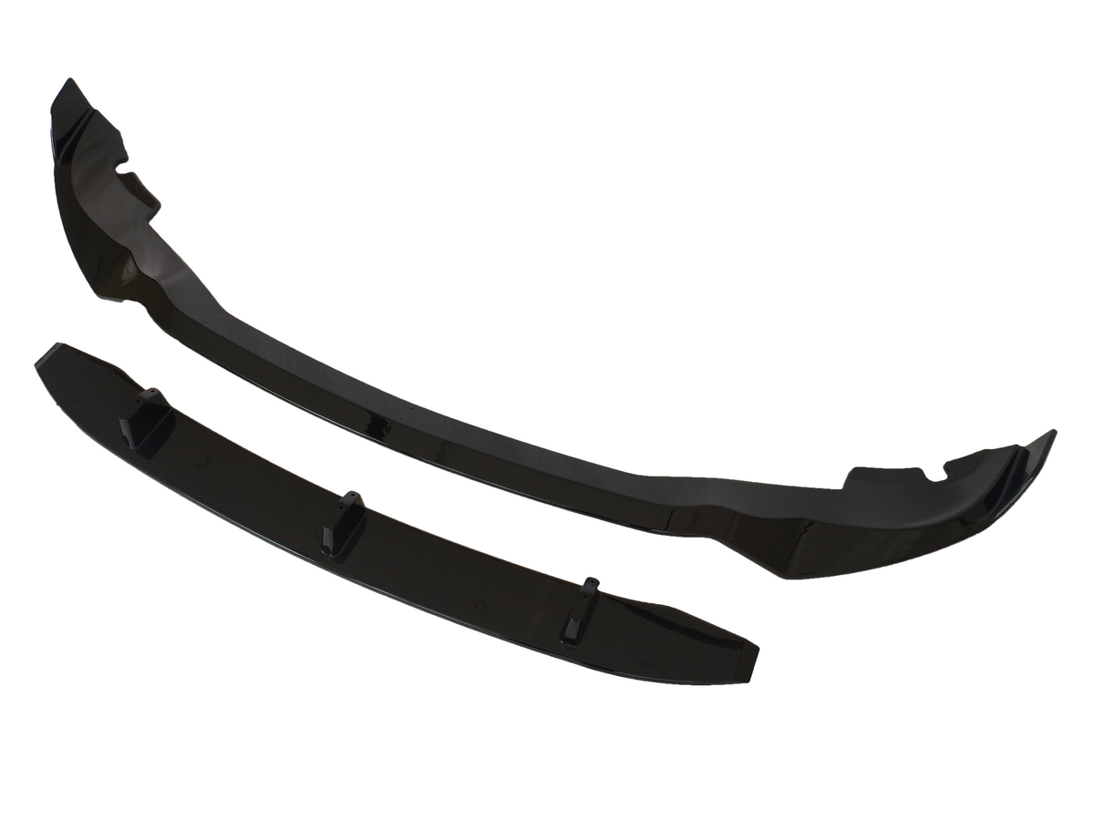 Two glossy black car bumper lip spoilers, positioned side by side, are displayed on a white background. The larger piece features curved ends, while the smaller piece is rectangular with fins.