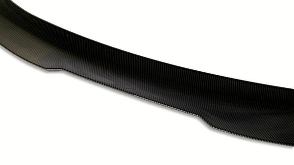 Curved carbon fiber object with a glossy finish, positioned against a plain white background, highlighting its texture and sleek design.