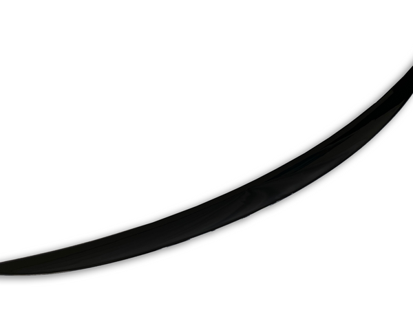 A single, black, curved object resembles a blade or tusk, positioned diagonally against a plain white background, suggesting a sleek and minimalist design.