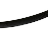 A glossy black curved object, possibly a part of a larger structure, bends gracefully against a plain white background.