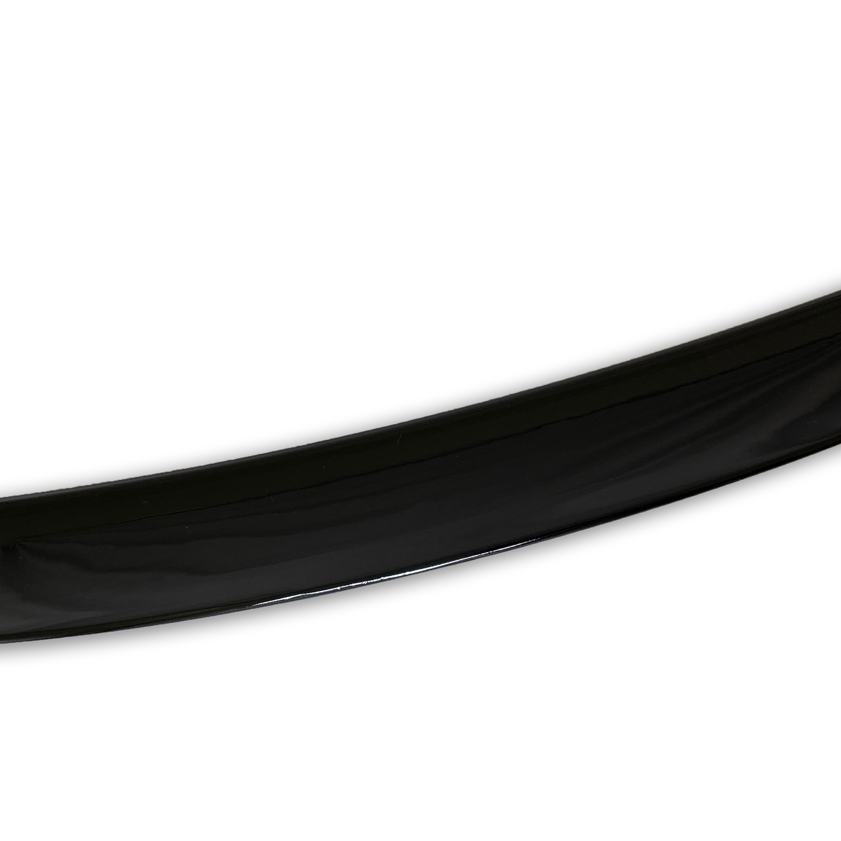 A glossy black curved object, possibly a part of a larger structure, bends gracefully against a plain white background.