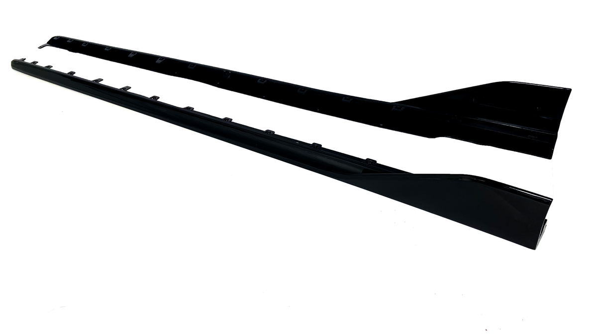 Two long, black car side skirts are positioned parallel on a white background, showcasing attachment points and a sleek, aerodynamic shape.