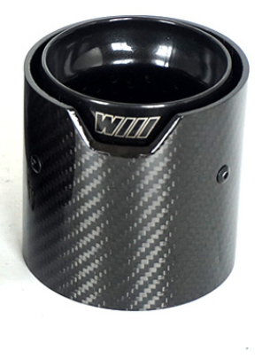 A carbon fiber exhaust tip with a glossy finish and ridged texture displays a logo reading "WILL" on its top edge. It rests on a plain white surface.