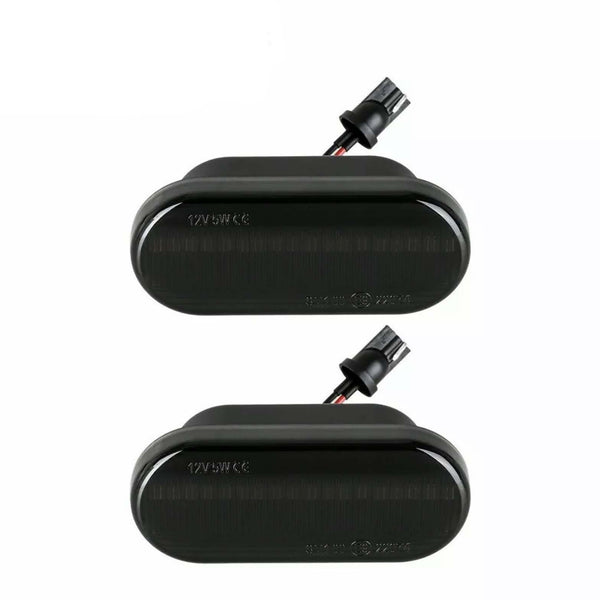 Two black rectangular automotive lights with connectors attached, displayed on a plain white background. Text on lights reads "12V 5W CE".