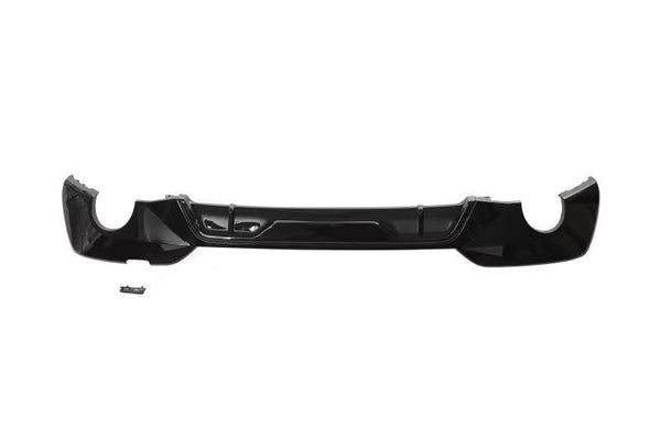A sleek, black car bumper with a glossy finish is positioned horizontally, isolated on a white background. A small, separate component lies below the main bumper.