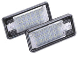 Two rectangular LED lights with a textured surface, positioned overlapping. The units are encased in clear plastic and set against a white background.