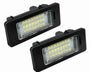 Two rectangular LED lights, displaying a grid pattern, are placed side by side. Each light has a black casing and clear lens with visible yellow diodes, set against a plain white background.