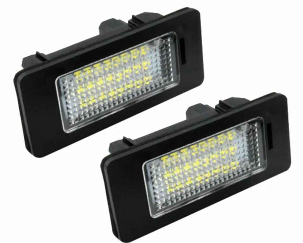 Two rectangular LED car lights with rows of small yellow diodes, surrounded by a black casing, are positioned against a white background.