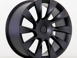 Black alloy wheel with a sleek, multi-spoke design is upright against a plain white background, highlighting its modern and aerodynamic appearance.