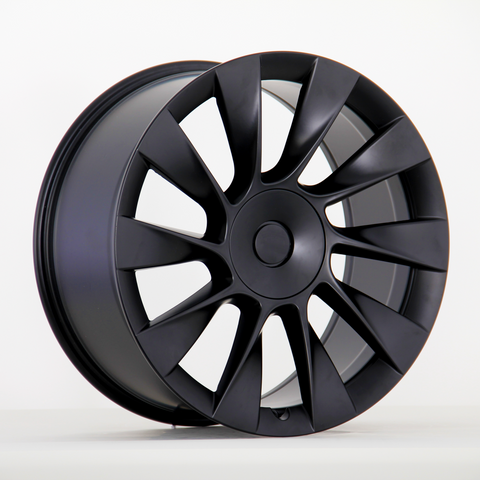 Black alloy wheel with a sleek, multi-spoke design is upright against a plain white background, highlighting its modern and aerodynamic appearance.