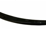 A sleek, black, curved car spoiler rests against a plain white background, showcasing its aerodynamic design and glossy finish.