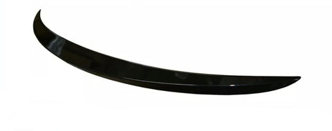 A sleek, black, curved car spoiler rests against a plain white background, showcasing its aerodynamic design and glossy finish.