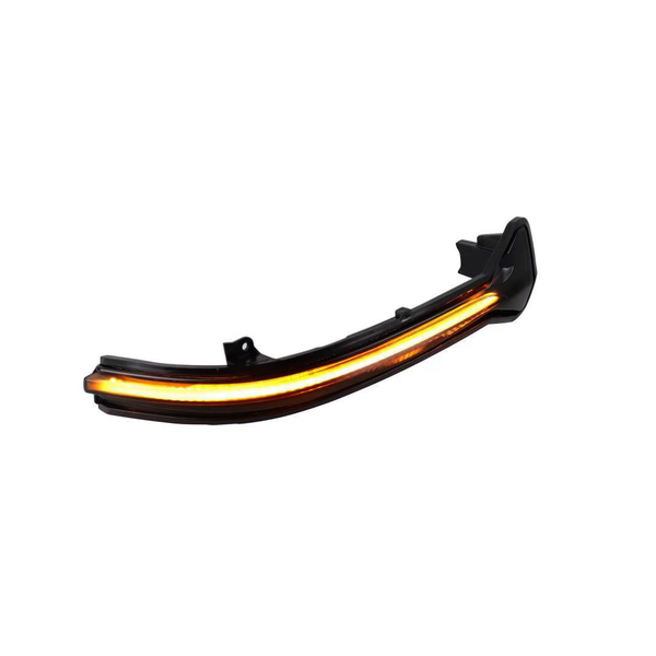 Curved black car headlight with amber LED strip illuminated, set on a plain white background.