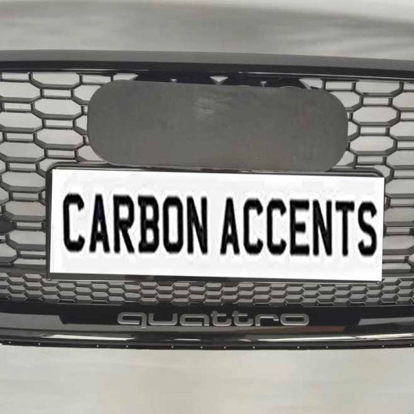 Grille with honeycomb pattern displayed on a light background. It features text "CARBON ACCENTS" on a license plate, with "quattro" written below in smaller lettering.