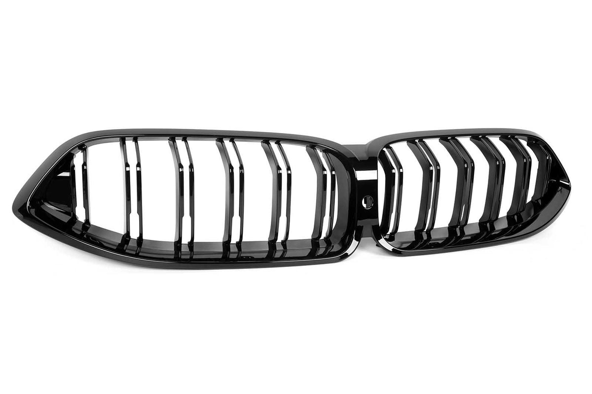 A black dual kidney-shaped car grille with vertical slats, set against a white background.