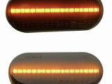 Two oval amber LED lights, one above the other, glow with horizontal strips of light. Both have inscriptions: 