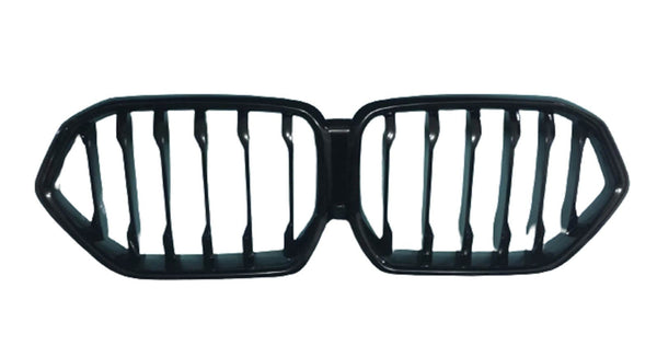 A black automotive grille with a dual-kidney shape, featuring vertical slats. It is isolated on a white background, suggesting it's a part removed for display.