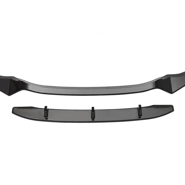 A black car front splitter sits separately on a white background. The upper piece has a curved shape with aerodynamic features, while the lower piece appears flat with mounting points.
