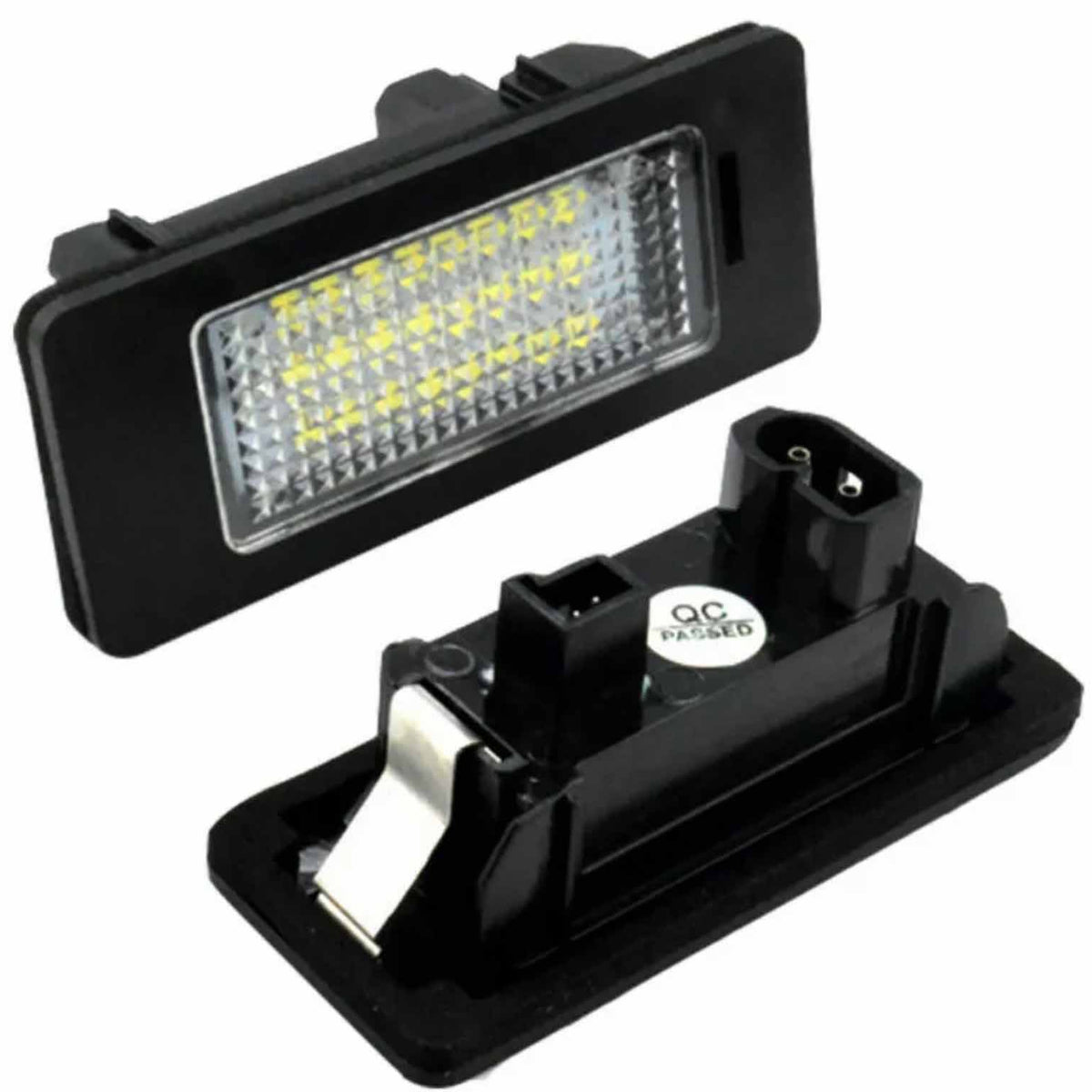 Rectangular LED light fixture with a grid of yellow diodes is connected to a black plastic housing. A "QC PASSED" sticker is visible on the back component.