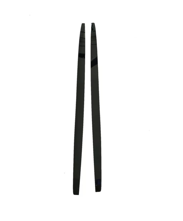 Two black, shiny chopsticks are positioned parallel to each other on a plain white background. The chopsticks are straight, slender, and taper towards one end.