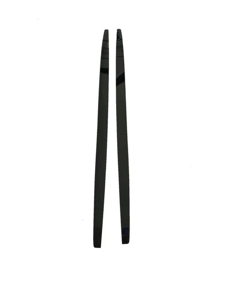 Two black, shiny chopsticks are positioned parallel to each other on a plain white background. The chopsticks are straight, slender, and taper towards one end.