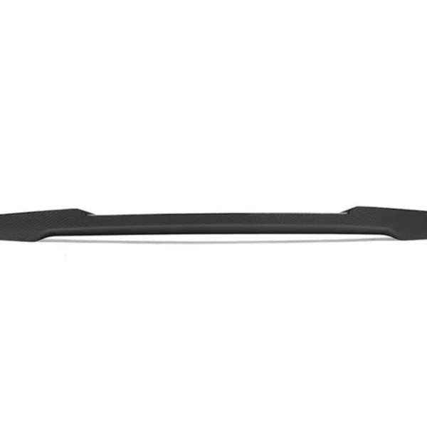 A sleek, black, elongated car spoiler rests horizontally against a plain white background, illustrating its aerodynamic shape and texture with no additional text or features.