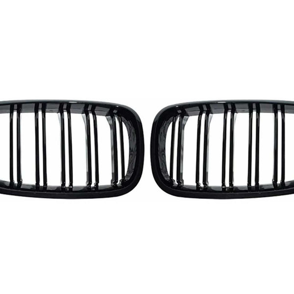 Two black, rectangular car grilles with vertical slats are symmetrically positioned on a plain white background, showcasing a sleek design.