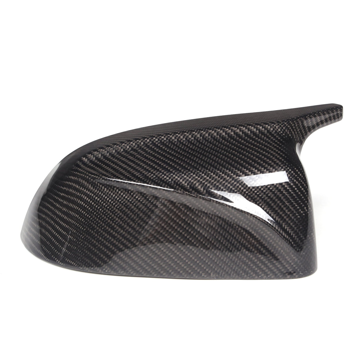 A glossy, carbon fiber car side mirror cover is positioned against a plain white background. It features a textured pattern typical of carbon fiber materials, showcasing aerodynamic design.
