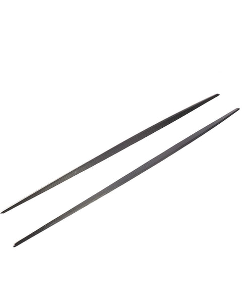 Two black metal chopsticks are parallel, resting on a plain white background, showcasing their sleek, slender design.