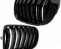 Two glossy black car grilles with vertical slats are positioned diagonally, contrasting against a plain white background. The grilles have a sleek, modern design with shiny reflections.