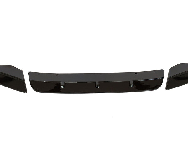 Three black car bumper parts, including a central spoiler and two end pieces, are aligned horizontally on a white background, suggesting an automotive component layout.