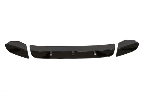 Three black car bumper parts, including a central spoiler and two end pieces, are aligned horizontally on a white background, suggesting an automotive component layout.