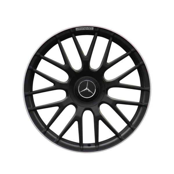A black multi-spoke car wheel rim features a central Mercedes-Benz logo with the text "AMG" on the edge, set against a plain white background.