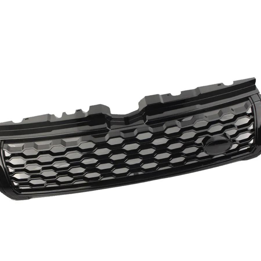 A black car grille features a honeycomb pattern, with a smooth emblem section. It rests in isolation against a plain white background.