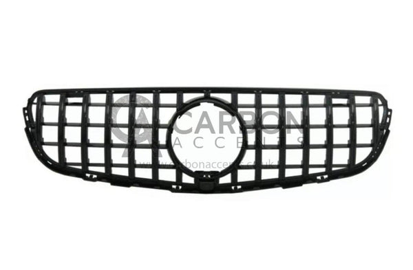 A black, rectangular automotive grille with a honeycomb design, centered round opening, displayed against a white background. Text overlay reads: "CARBON ACCENTS www.carbonaccents.co.uk".