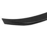A sleek, curved black car spoiler, positioned on a plain white background, highlighting its aerodynamic design with smooth surface and contoured edges.