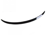 A black, curved spoiler lies on a plain white background, showcasing a glossy finish.