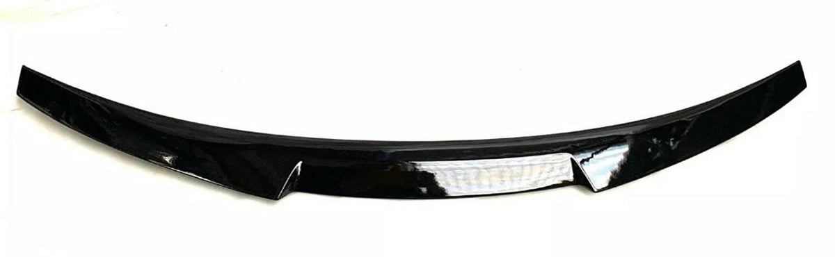 A black car spoiler with a glossy finish is positioned horizontally on a plain white background. The design is sleek, slightly curved, and features a central reflective strip.