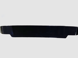 A sleek, black, elongated object lies horizontally, possibly an automotive spoiler or similar accessory, set against a plain light gray background.